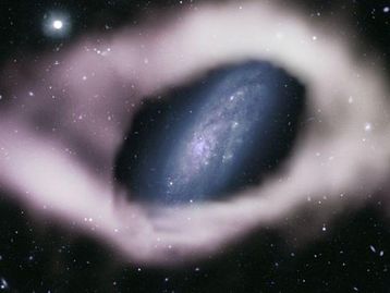 Astrônomos descobrem galáxia rara 'embrulhada' com fita cósmica 