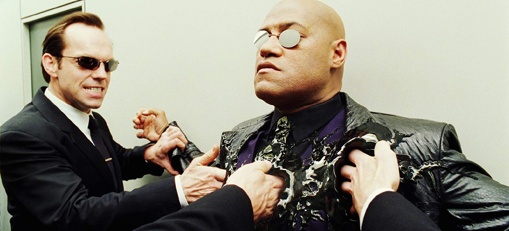 Laurence Fishburne e Hugo Weaving não irão reprisar seus papéis em Matrix 4 (Fonte: IMDb/Reprodução)