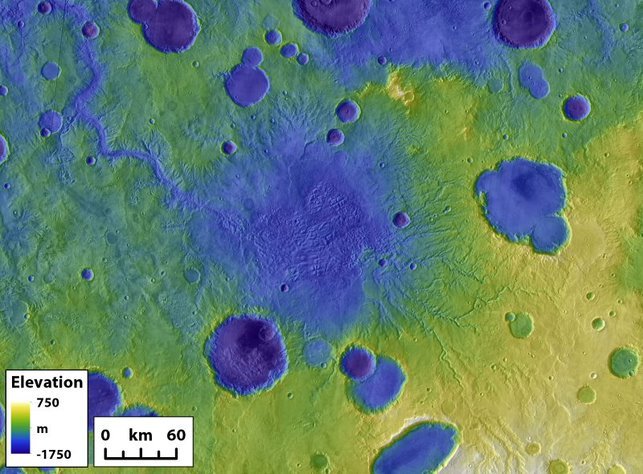 Exemplo de uma bacia de lago em Marte (centro) e um desfiladeiro de saída (acima à esquerda) que se formou a partir de uma enchente