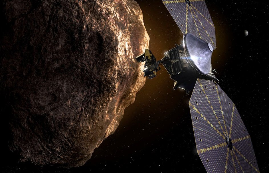 Uma ilustração de Lucy em funcionamento, próxima de um asteroide e com os paineis solares em funcionamento
