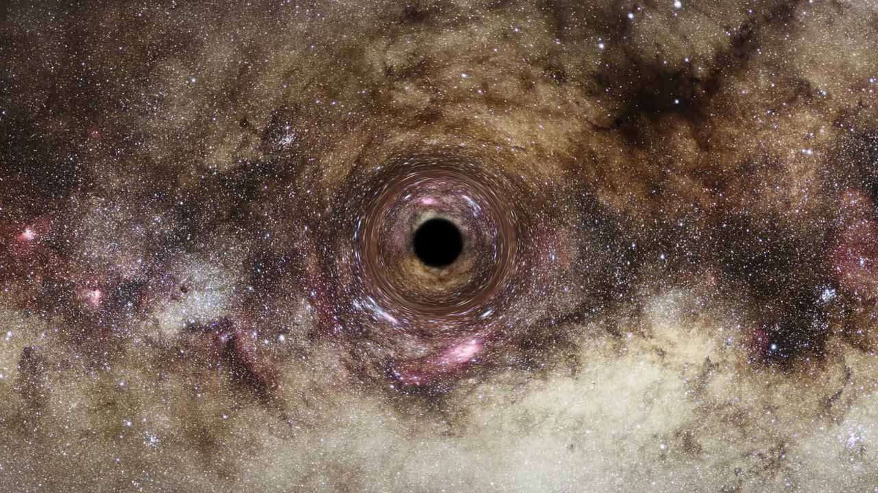 A equipe de cientistas afirma que as lentes gravitacionais permitem estudar buracos negros inativos.
