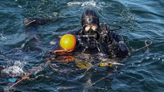 Research team member on first dive into underwater construction.