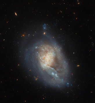 Although most of the image represents dwarf galaxy IC 3476, stars and more distant galaxies appear to be forming in some spots.