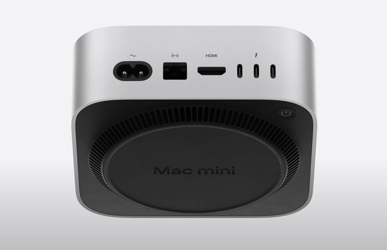 O Mac mini visto de baixo, com o polêmico botão de energia no canto.