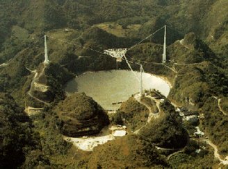 Arecibo Observatory (image) collapsed in 2020 following negligent structural work. Credit: SETI.