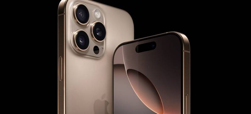 dois iPhone 16 lado a lado na cor dourada em um fundo preto, um deles com a tela virada para frente